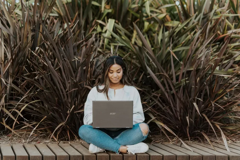 Female student using laptop