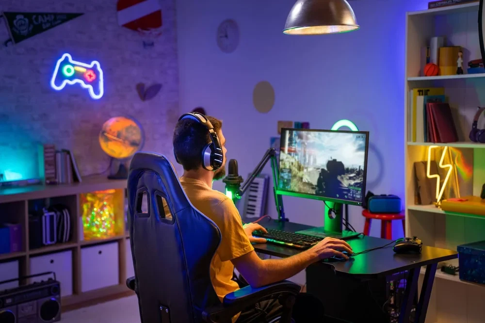 Professional Gamer Playing Online Game on Computer with Colorful Neon Led Lights