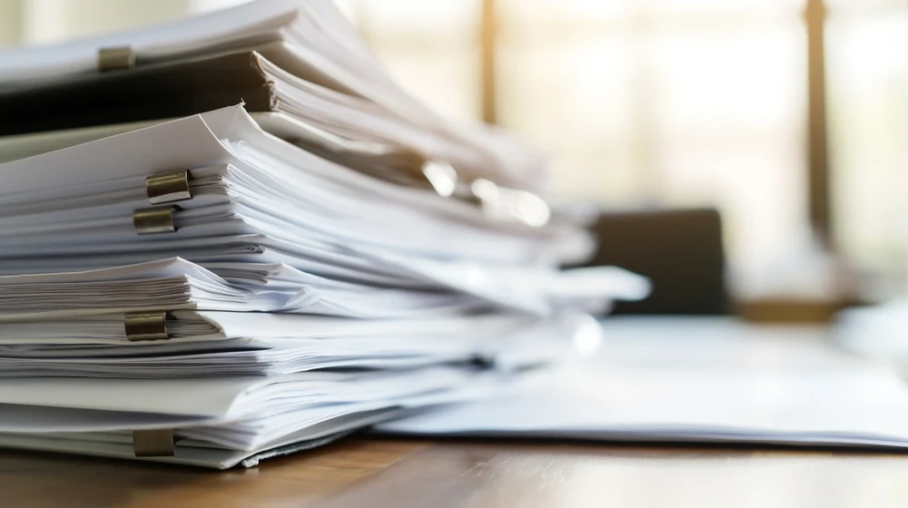 A thick stack of organized hard copies.
