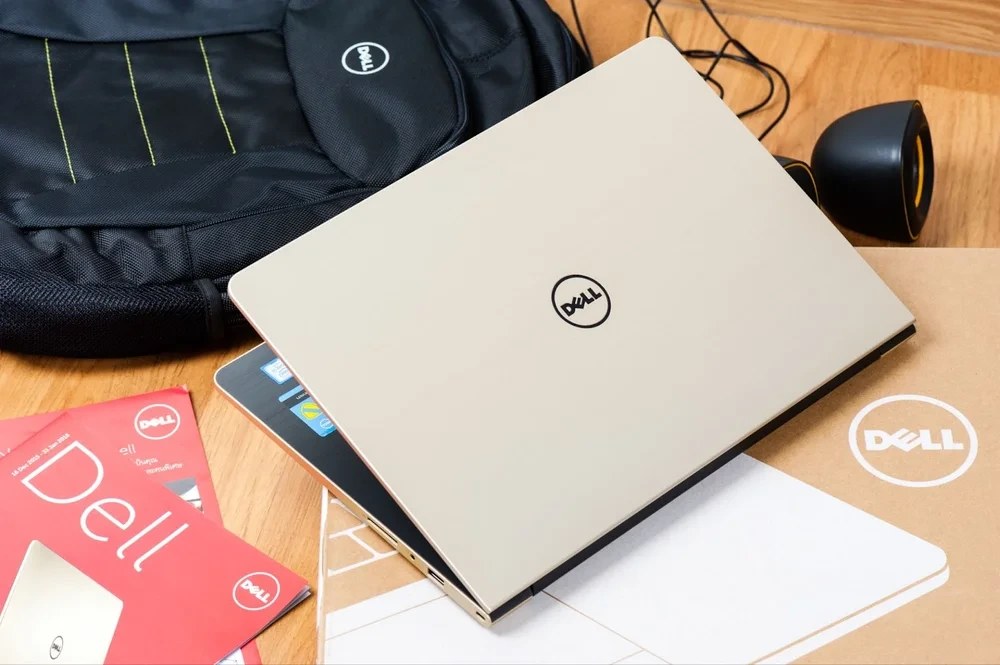 Dell branding with various Dell products including a Dell laptop