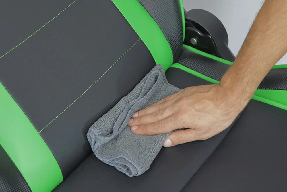 Man is cleaning a gaming chair